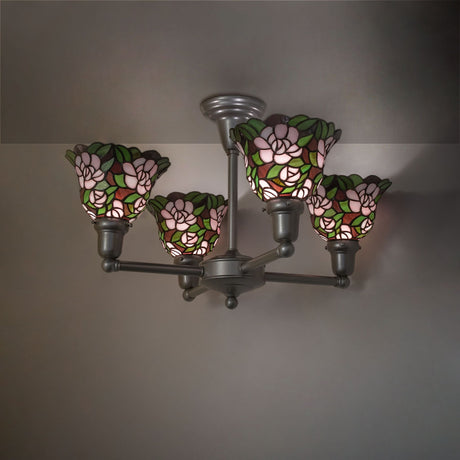 Begonia 4 light chandelier illuminated in room setting with floral stained glass shades.