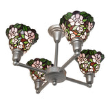 Bottom angle view of 4 light chandelier highlighting floral glass and metal framework.