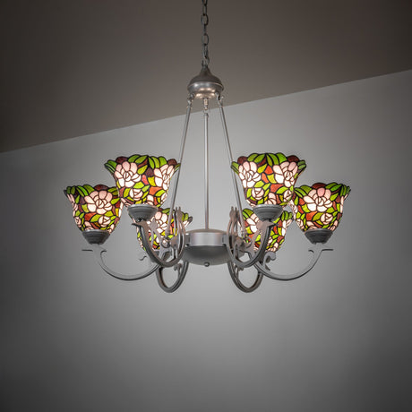 Begonia 6-light chandelier with illuminated stained glass floral shades in an interior setting.