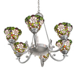 Bottom angle view of chandelier highlighting stained glass shades and central metal hub.