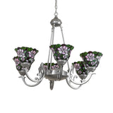 Unlit view of chandelier with blush pink stained glass floral shades and light sandstone finish.