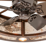 Close-up of fan hub and downlight detail with rustic bronze finish.