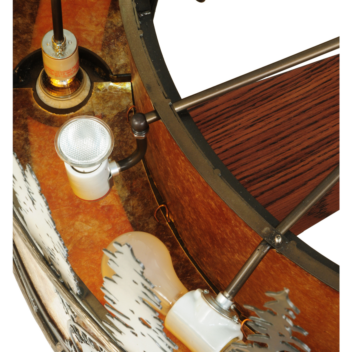 Close-up of bulb socket and amber mica panel inside Black Dog Lodge Chandel-Air.