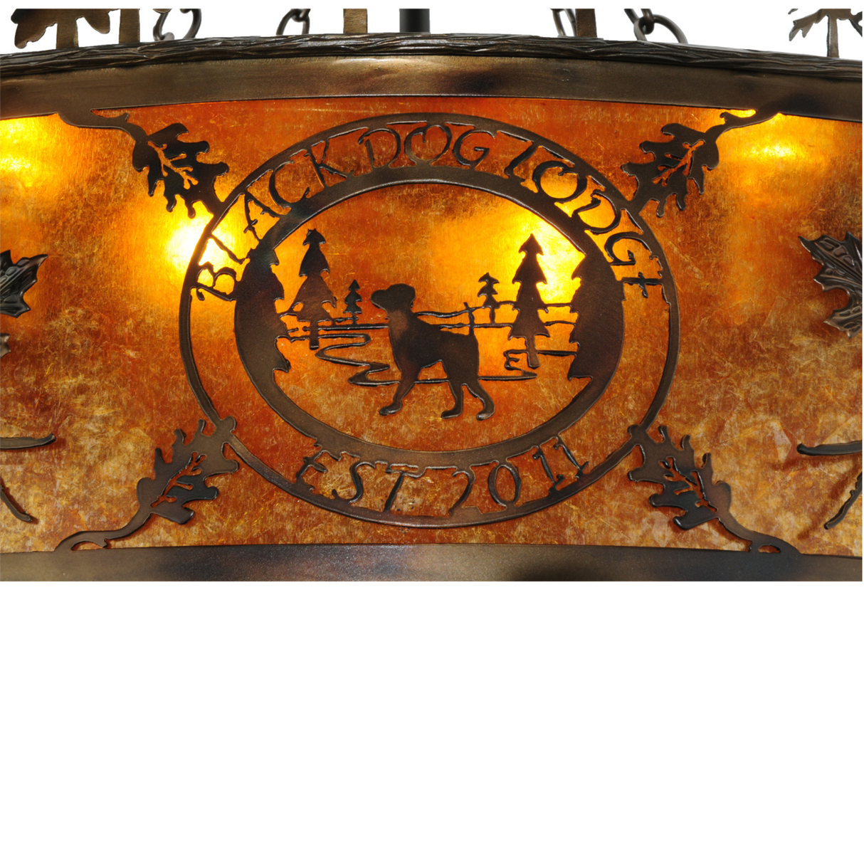 Detailed close-up of Black Dog Lodge logo illuminated on amber mica panel.