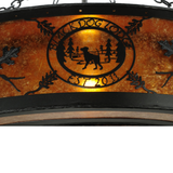 Close-up of Black Dog Lodge logo design on glowing amber mica shade.