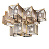 Lit view of chandelier featuring brushed brass cube frames, crystal beads, and granite glass panels.