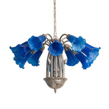 Blue Tiffany Pond Lily 12 light chandelier shown unlit with clear shade details.