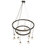 Angled view of 12 light 2 tier chandelier with suspended glass orb pendants on adjustable cords.