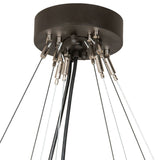 Closeup of chandelier ceiling canopy and suspension cable hardware in oil rubbed bronze finish.