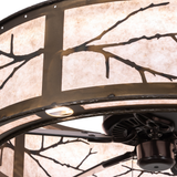Close-up of metal branch detail and warm mica illumination.