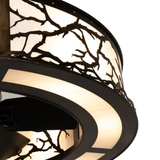 Closeup showing intricate branch motif and softly glowing Idalight shade.