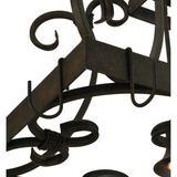 Close-up view of hand-forged scroll design on Caiden chandelier.