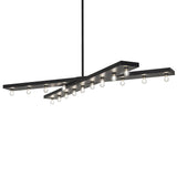 Caldero 17 light oblong chandelier with illuminated Edison bulbs in solar black finish.
