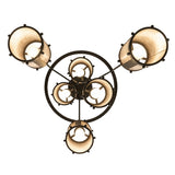 Bottom upward view showing the circular frame and cylindrical mica shades of the Cartier chandelier.