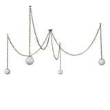 Unlit view of Castiliolite Bola chandelier showing suspended alabaster glass globes.