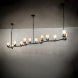 Cero 14-light oblong chandelier installed over dining area with warm ambient illumination.