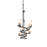 Angle view of 14-light oblong chandelier with curved metal frame and cylindrical glass shades.
