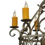 Detailed view of amber faux candlelight and holder on Cira chandelier.