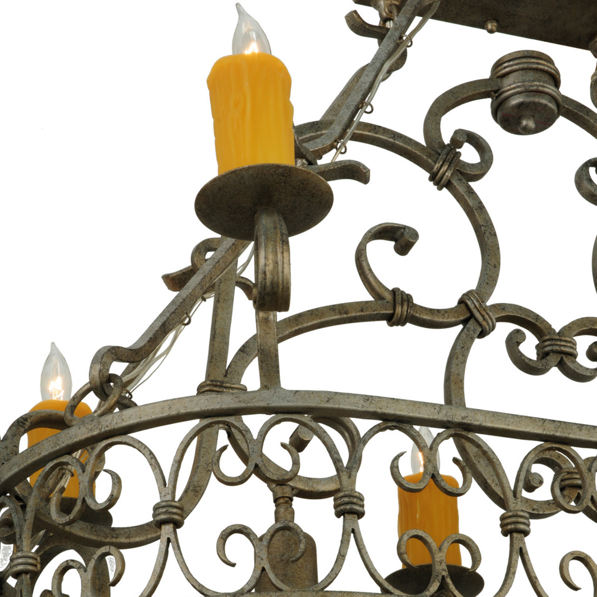 Close-up focus on scroll patterns and warm candlelight of Cira chandelier.