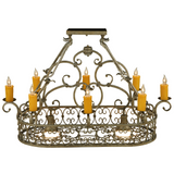 Close-up front view of Cira chandelier lit, showing candles and scroll frame.