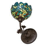 Artistic close-up of the stained glass on the Nightfall Wisteria wall sconce.
