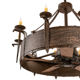 Close-up of rustic candlelight sconces and hammered copper finish.
