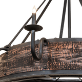 Closeup of wrought-iron candle arm and hammered copper band.