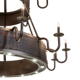 Closeup of candle arm detailing showing the textured copper and bronze finish.