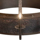 Single candle light closeup showing flame-style bulb and hardware texture.