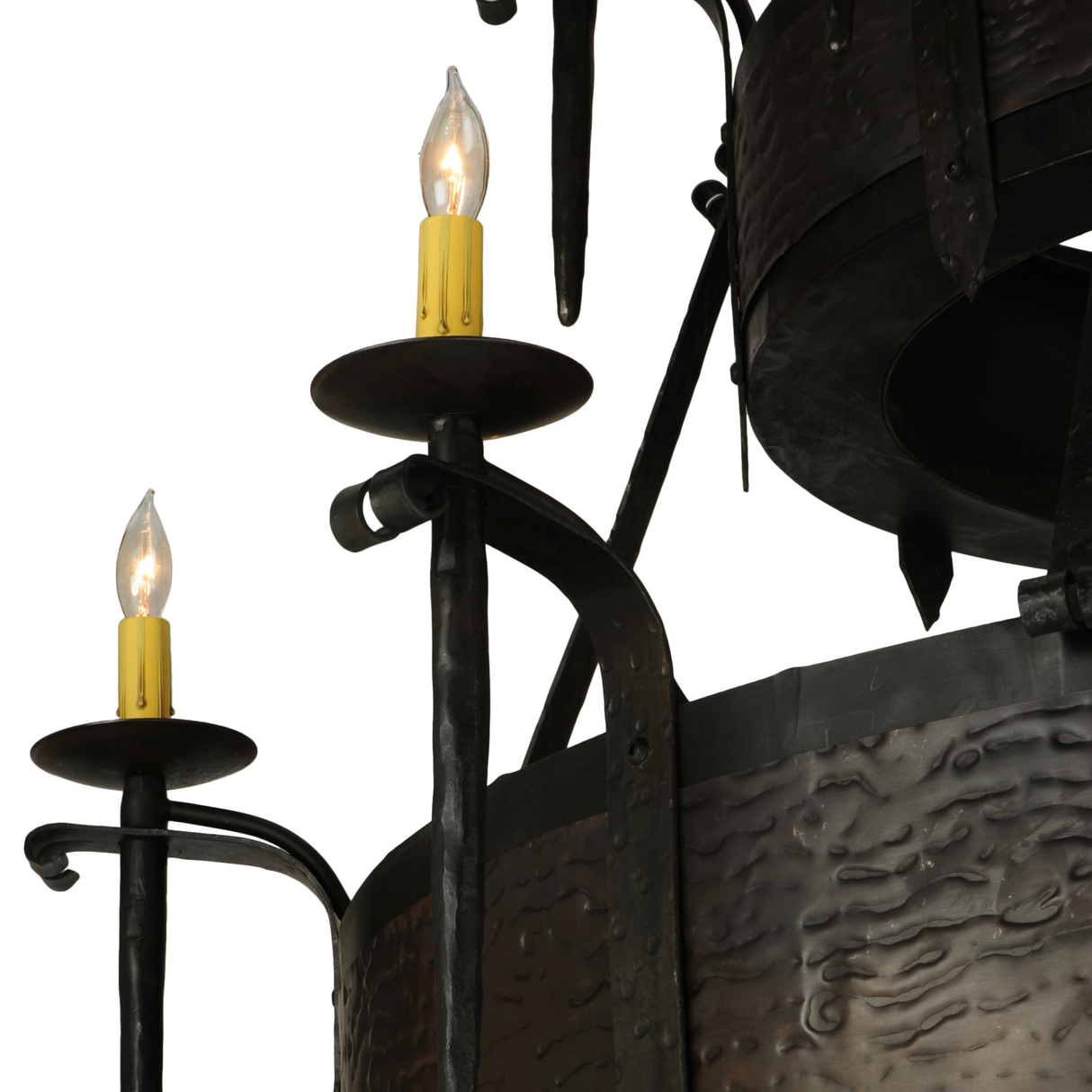 Candlelight detail with visible forged arm design.