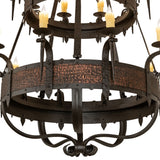 Close-up of Costello chandelier barkerized metal band and faux candlelights.