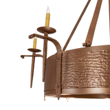 Close-up of hand-forged candle arms and hammered bronze texture.