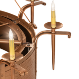 Detail view of candle-style bulb and sculpted arm in bronze finish.