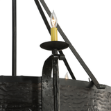 Close-up of candlelight sconce with forged iron detail.