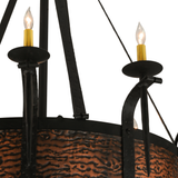Closeup of hammered copper band and black wrought iron arms.