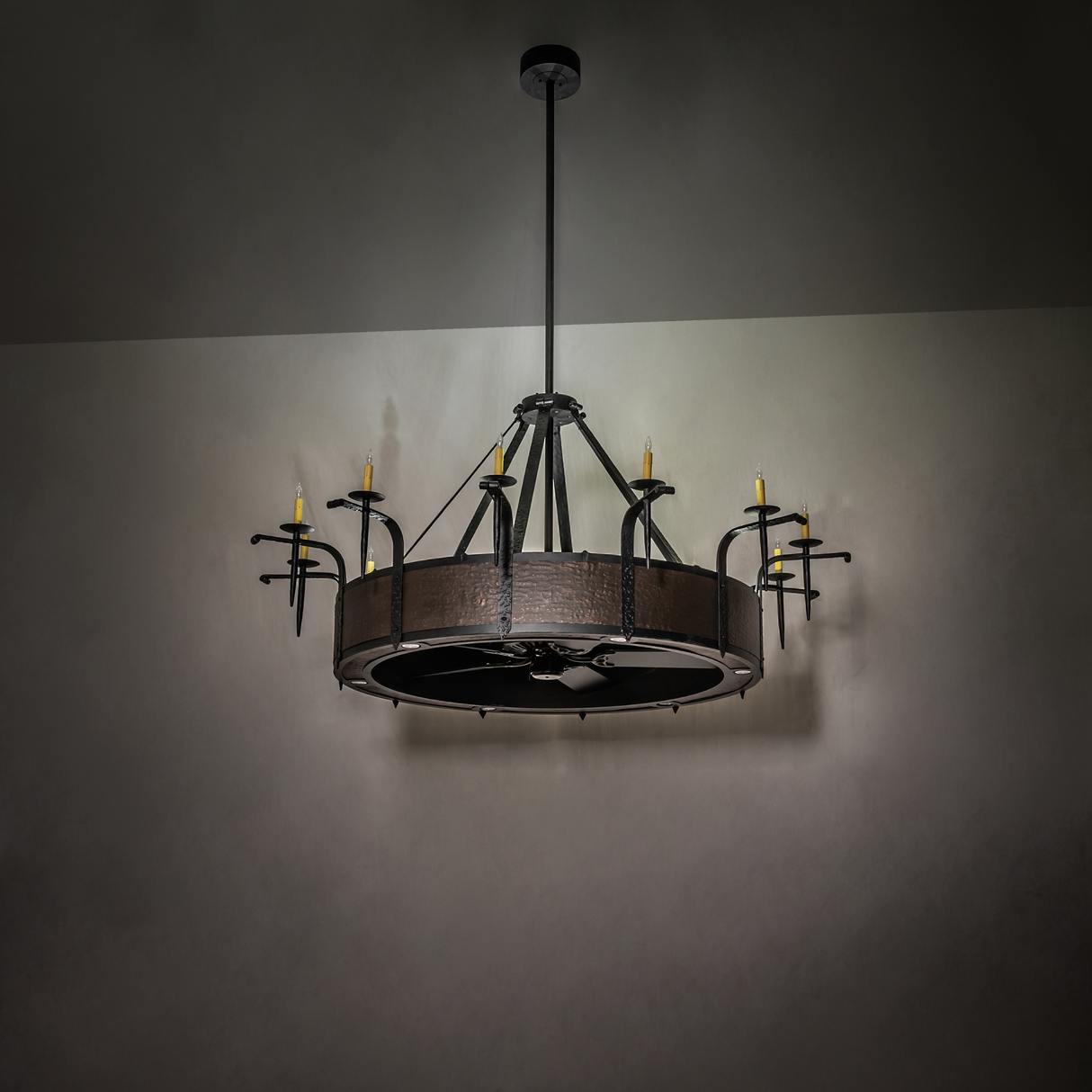 Dim-lit room setting showing chandelier’s subtle candlelight glow.