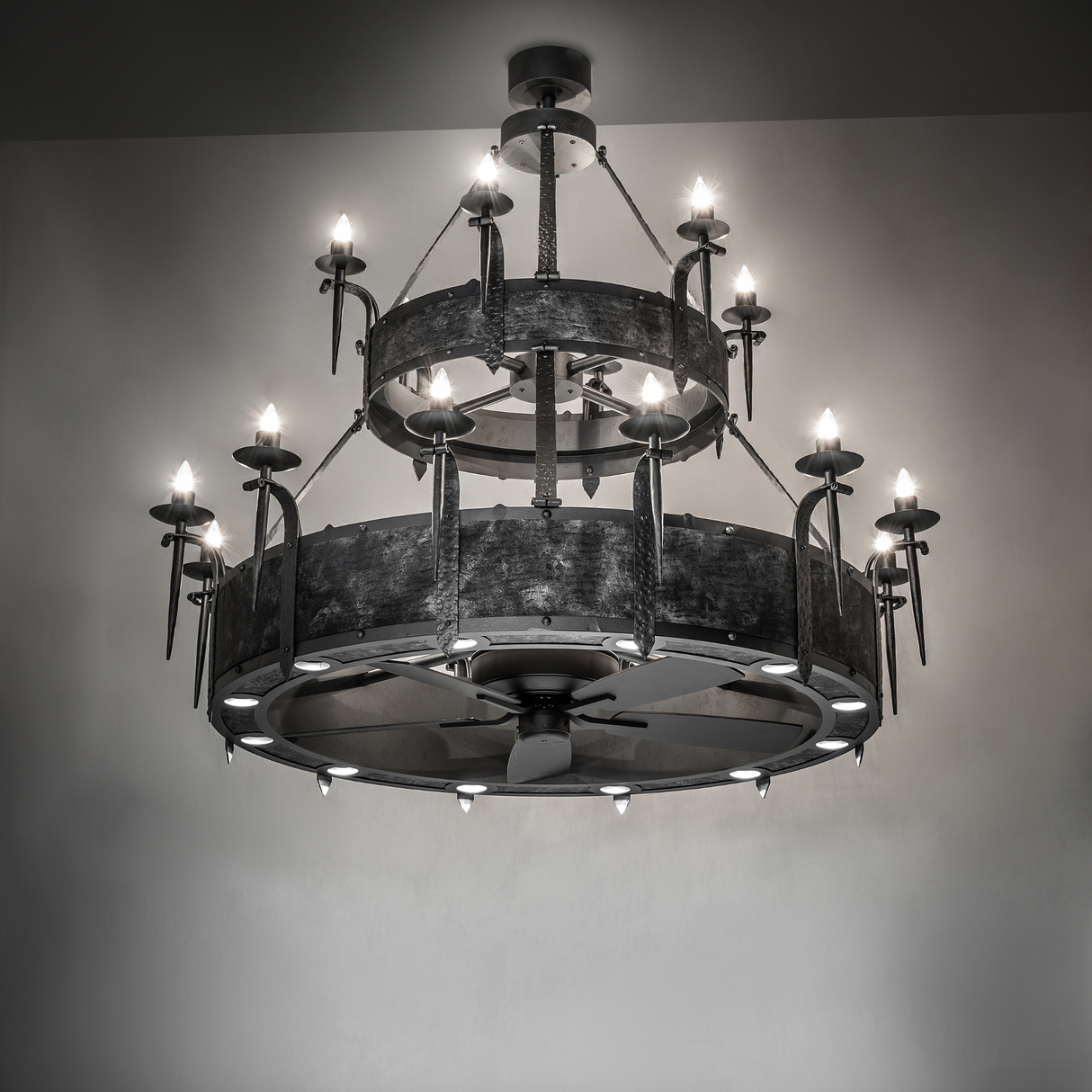 Costello Two Tier Chandel-Air chandelier fan glowing warmly in ambient room lighting.