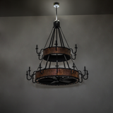 Dim-lit view of Costello chandelier fan showing rustic copper tones.