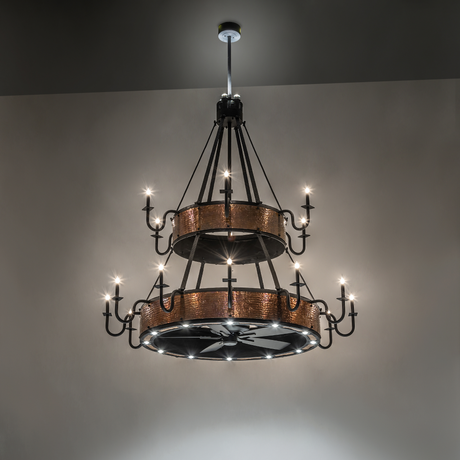 Illuminated Costello chandelier fan glowing in warm ambient light.