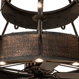 Close-up showing fan blades beneath glowing candlelight tiers.