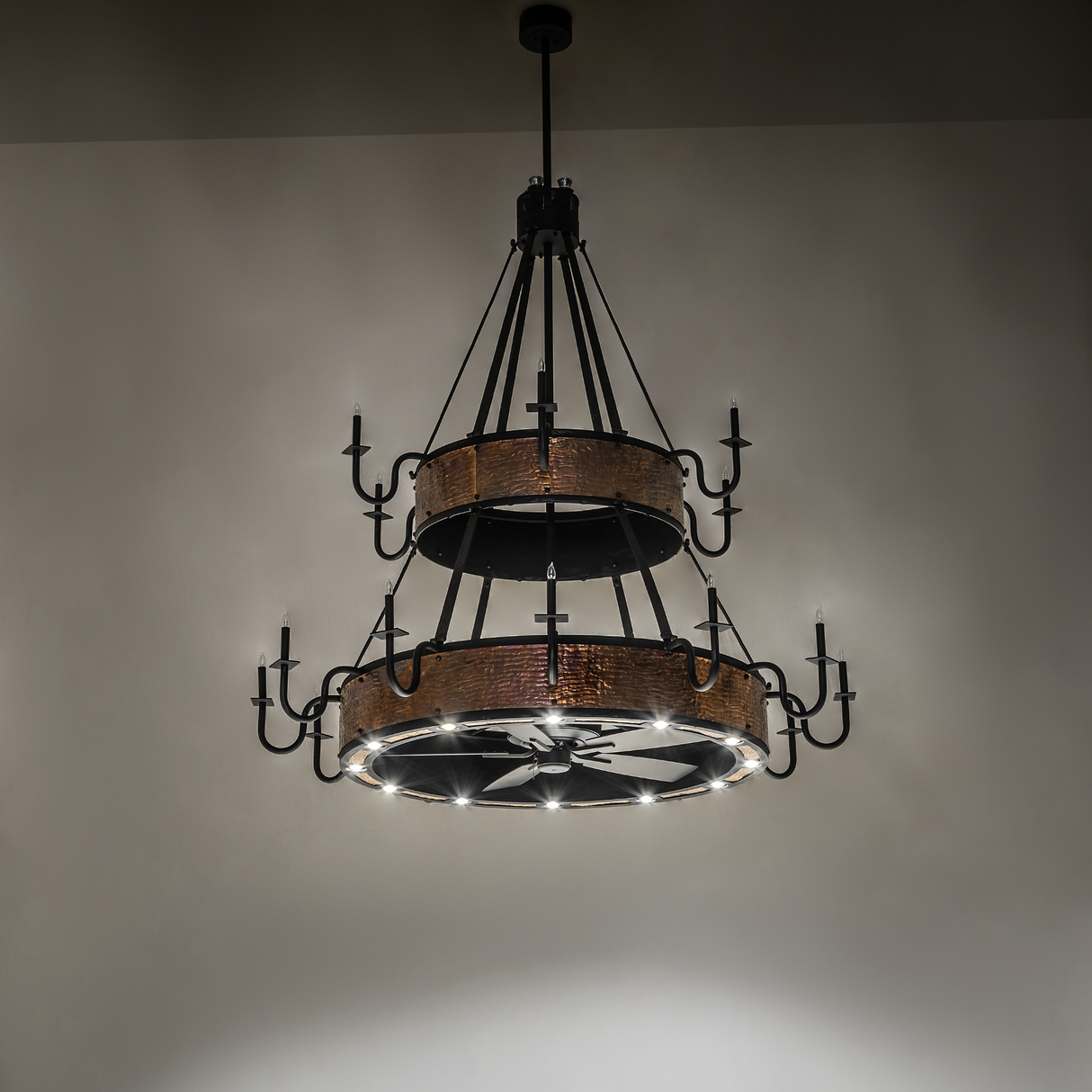 Illuminated Costello chandelier fan with hammered copper finish.