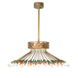 Side angle of 36 light chandelier with radial brass arms and verdigris copper cups.