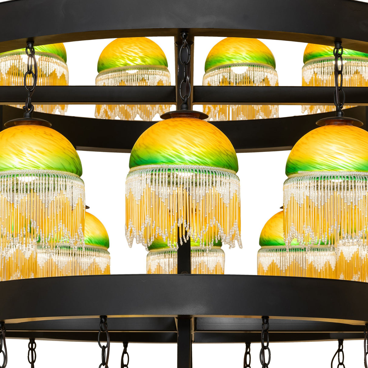 Close-up of glass shades arranged around chandelier ring.