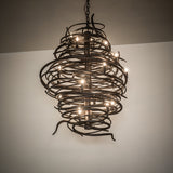 Cyclone 20 light chandelier illuminated in room setting ambient view.