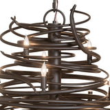 Close-up of Cyclone chandelier swirling iron bands and candle lights.