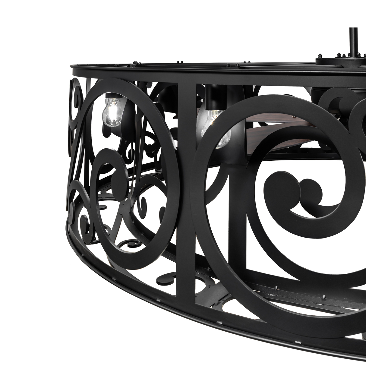 Close-up of Dean chandelier frame showing illuminated bulb and pattern cutouts.
