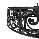 Close-up of Dean chandelier frame showing illuminated bulb and pattern cutouts.