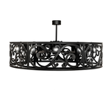 Side profile of Dean chandelier displaying circular scroll pattern and lighting.