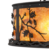 Close-up of black wrought iron oak leaf pattern on amber mica diffuser.