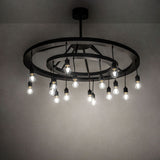 Donner 16 light chandelier shown illuminated in ambient interior setting.